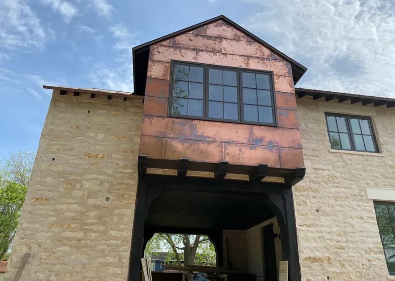 Copper metal panel facade on a stone building for Skylight Installation in Morris Plains