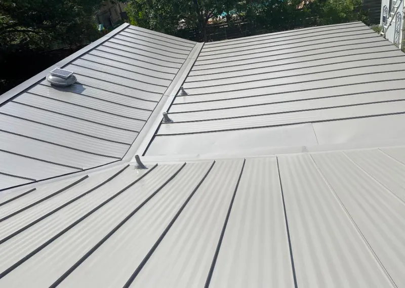 Solar attic fan installed on a metal roof for Roof Ventilation in Morris Plains